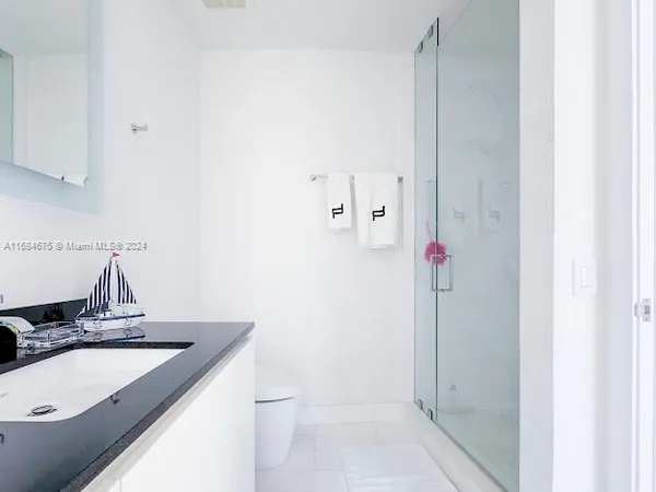 a bedroom with a bed and a television in it