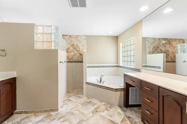 a kitchen with a sink a refrigerator and window