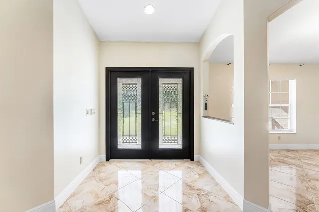 a view of an entryway with wooden floor and a window