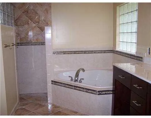 a view of a living room and floor to ceiling window