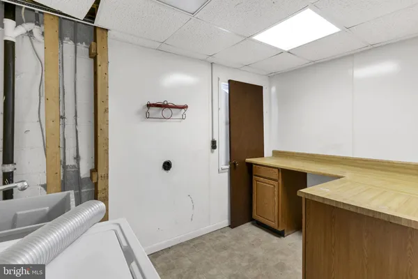 a bathroom with a tub and a sink