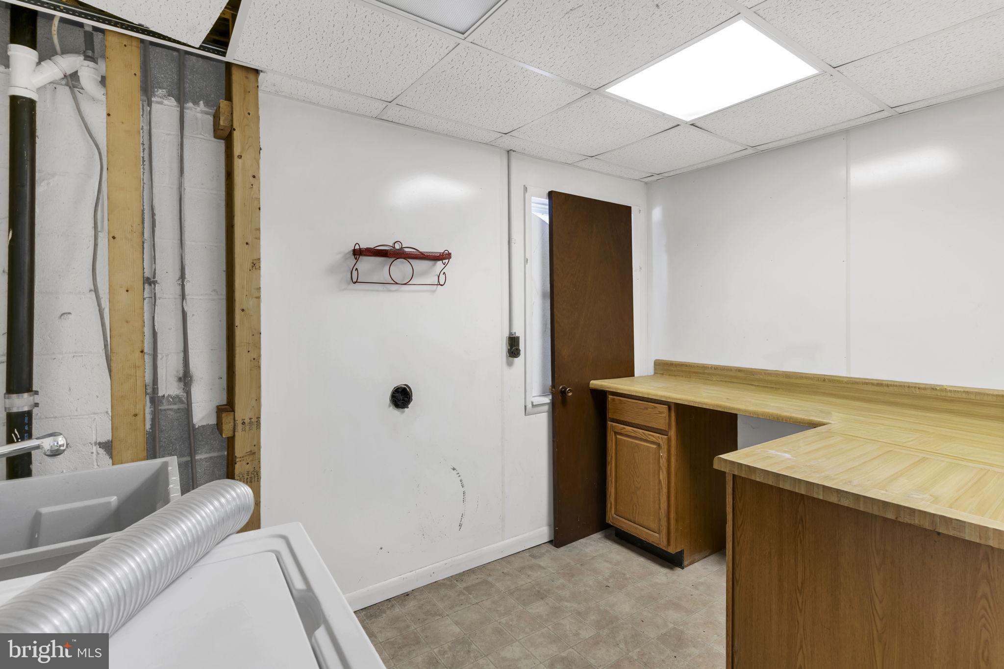 1150 Calvert Beach Road St. Leonard, MD 20685 - Photo 28 of 42 a bathroom with a tub and a sink