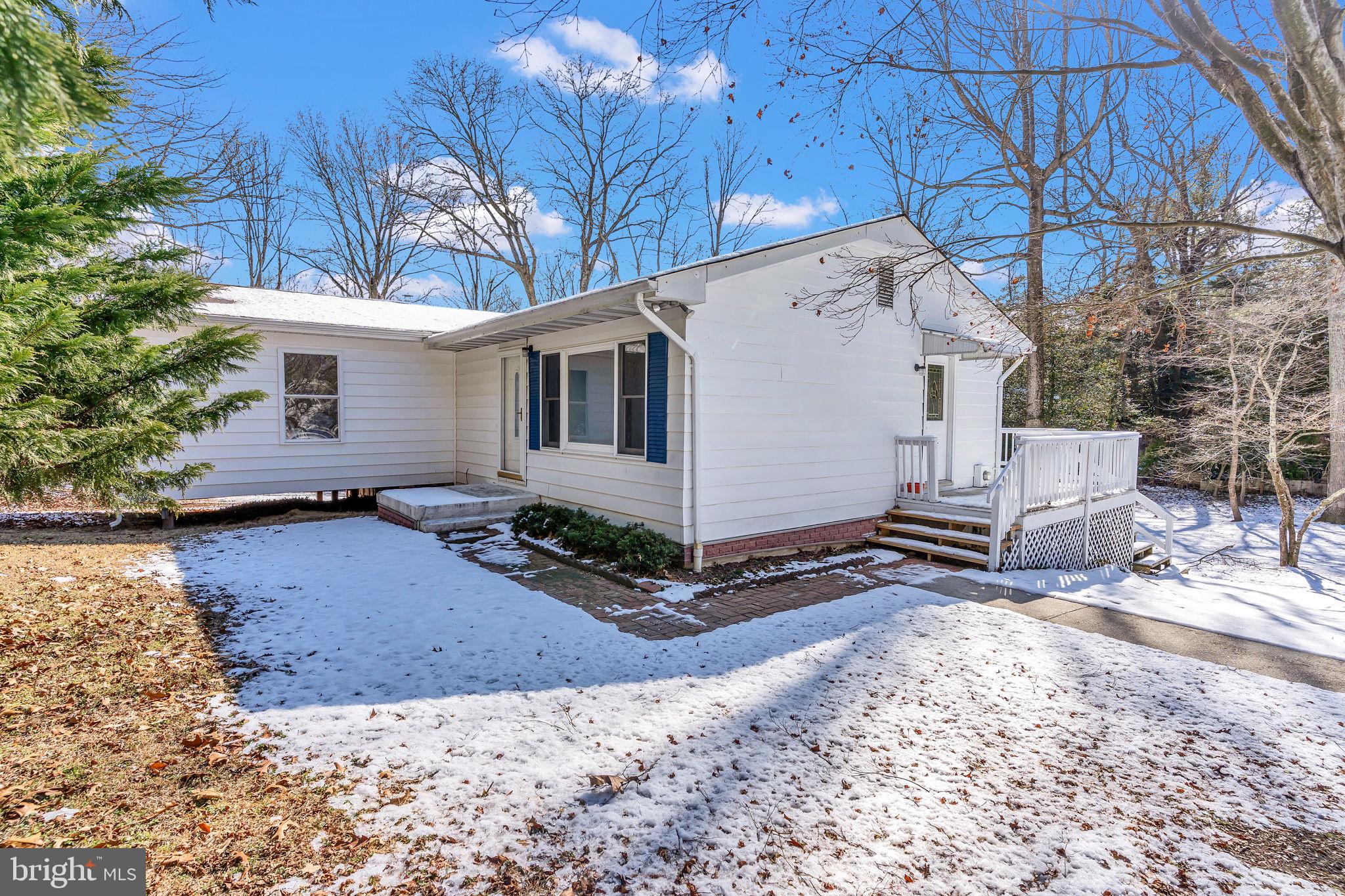 1150 Calvert Beach Road St. Leonard, MD 20685 - Photo 3 of 42 a view of a house with a yard covered in snow