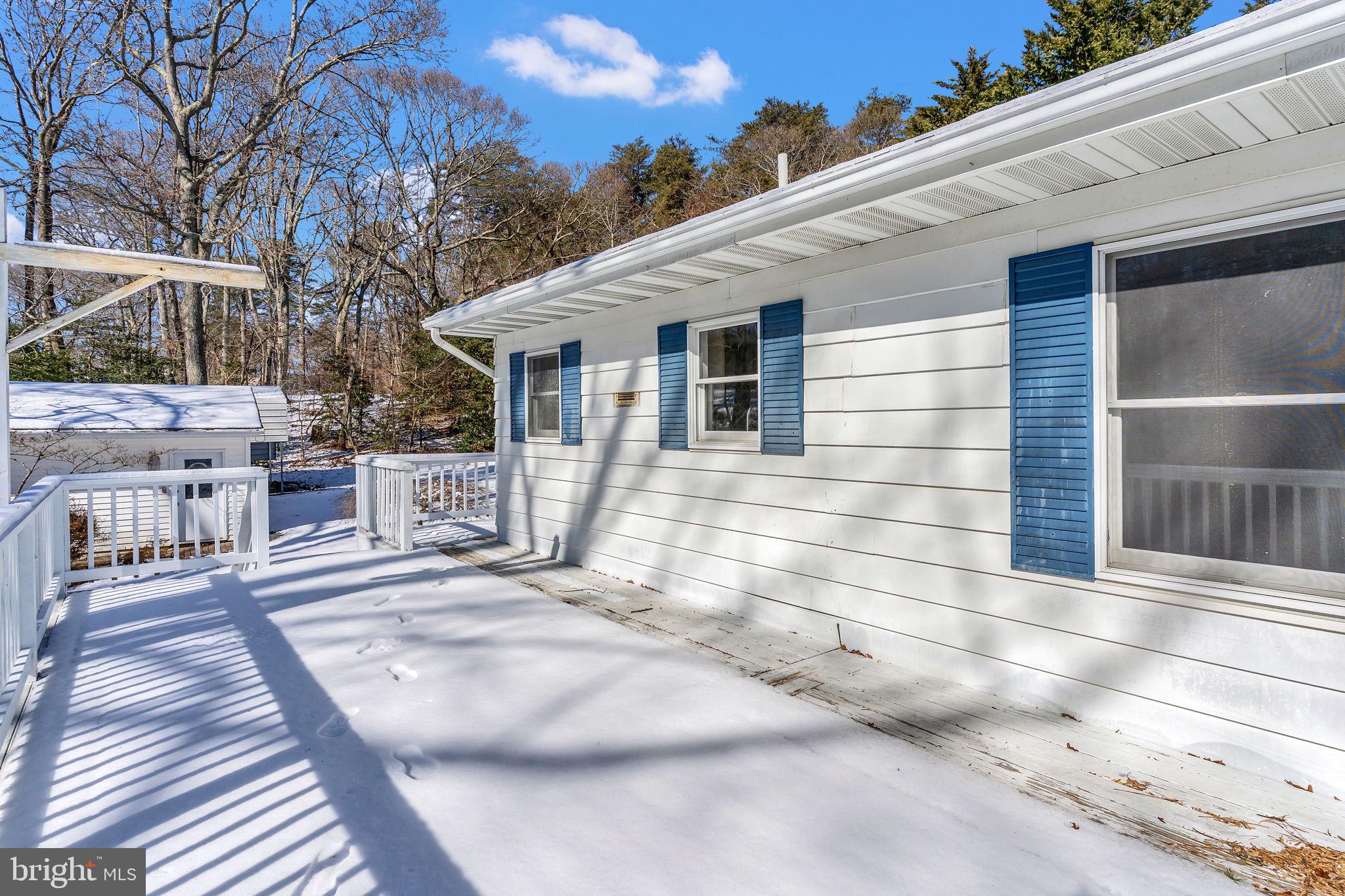 1150 Calvert Beach Road St. Leonard, MD 20685 - Photo 31 of 42 a view of a house with a patio