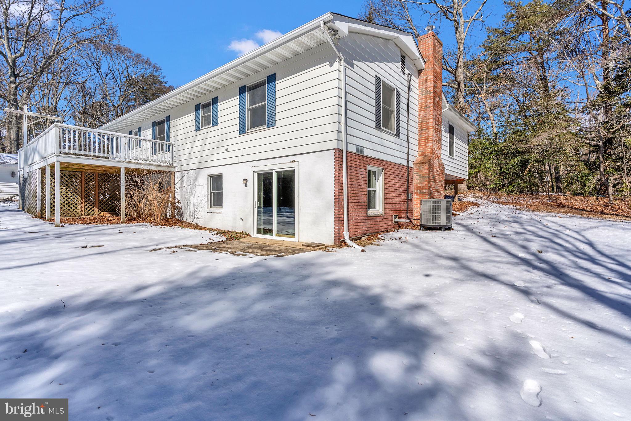 1150 Calvert Beach Road St. Leonard, MD 20685 - Photo 32 of 42 a view of a white house with a large space