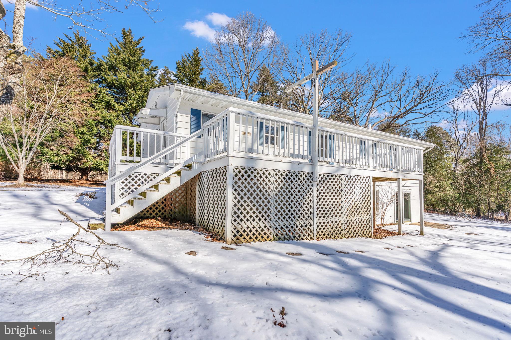1150 Calvert Beach Road St. Leonard, MD 20685 - Photo 34 of 42 a front view of a house with a garden