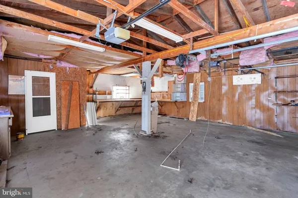 a view of a garage with wooden floors