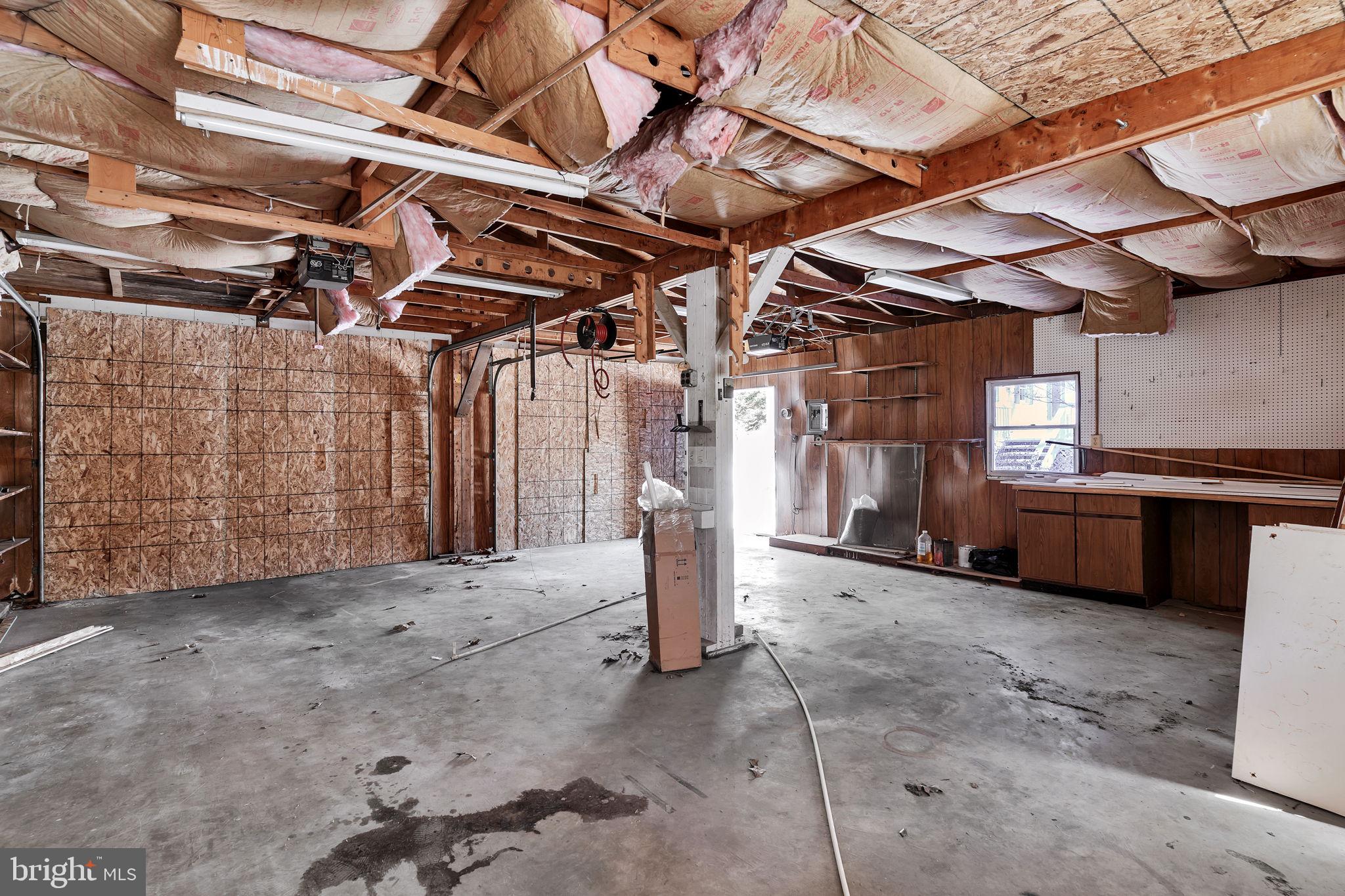 1150 Calvert Beach Road St. Leonard, MD 20685 - Photo 39 of 42 a view of a garage with wooden floors