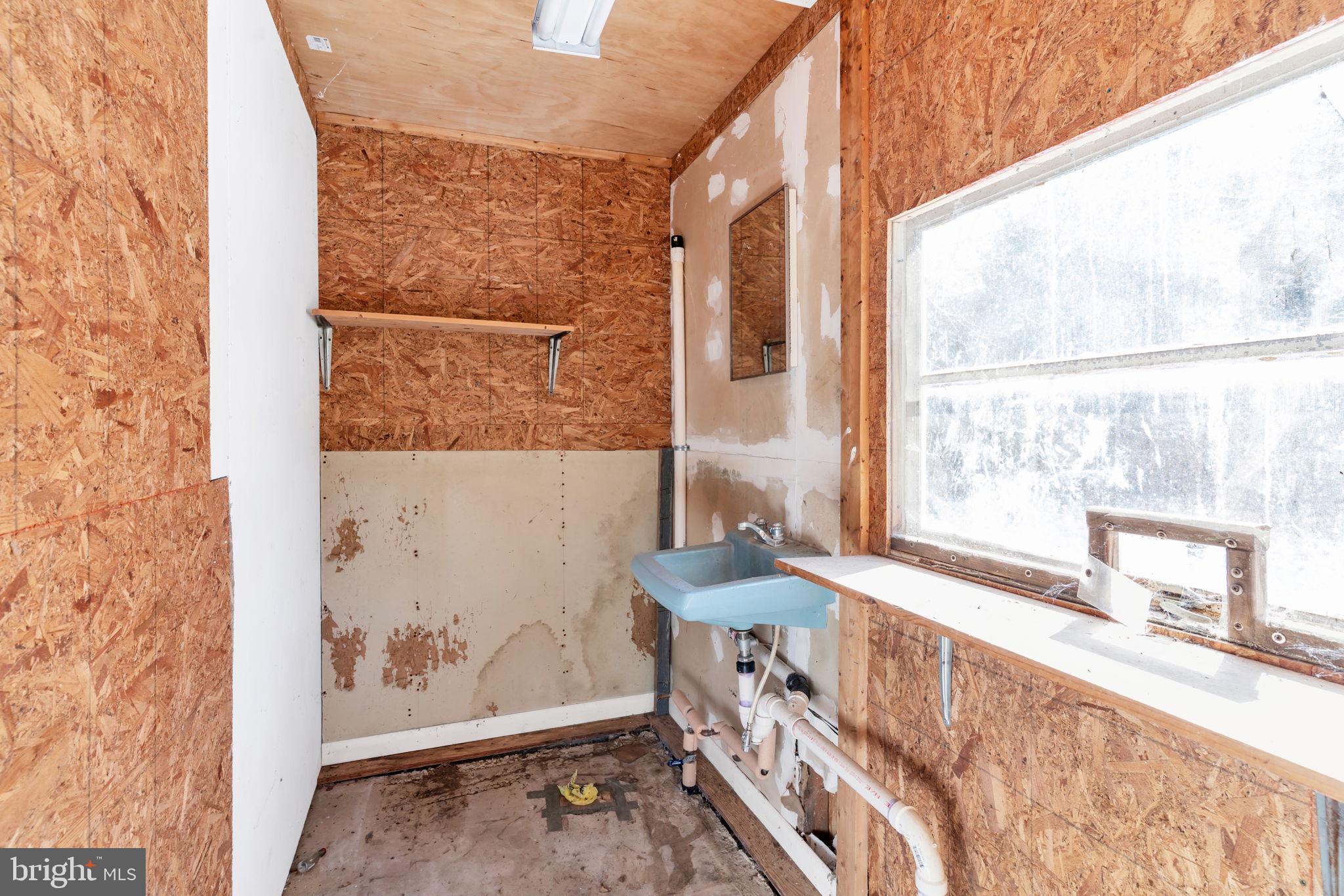 1150 Calvert Beach Road St. Leonard, MD 20685 - Photo 40 of 42 a view of a living room with a furniture and a window