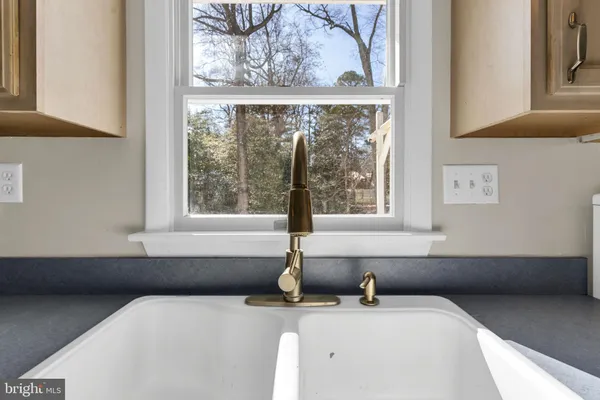 a bathroom with a sink and a window