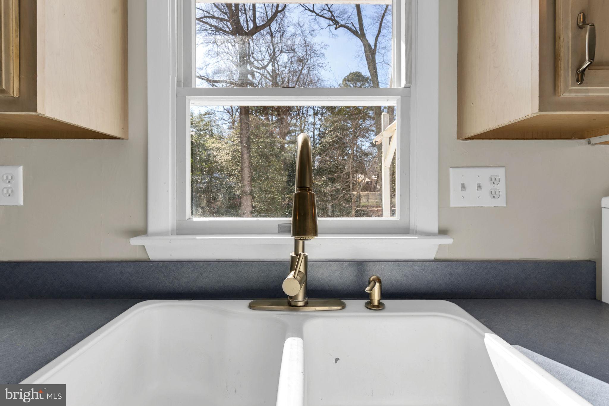 1150 Calvert Beach Road St. Leonard, MD 20685 - Photo 6 of 42 a bathroom with a sink and a window