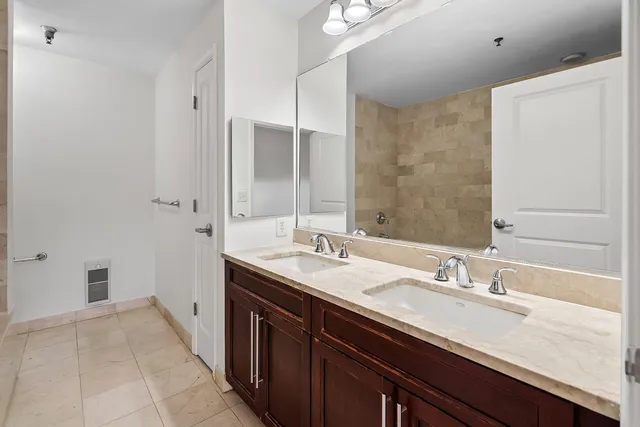 a bathroom with a bathtub and shower