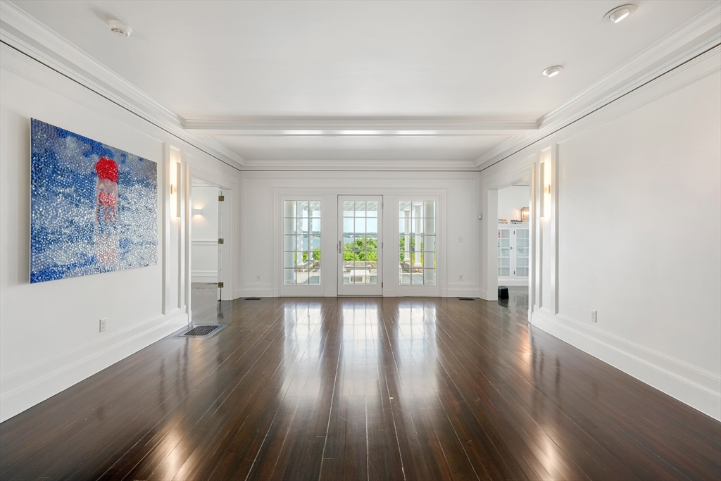 169 S Road Bourne, MA 02559 - Photo 11 of 42 a view of an empty room with wooden floor and a window