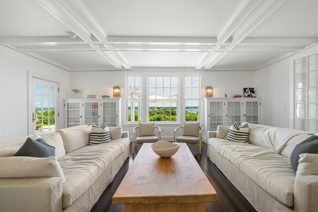 169 S Road Bourne, MA 02559 - Photo 12 of 42 a living room with furniture and a large window