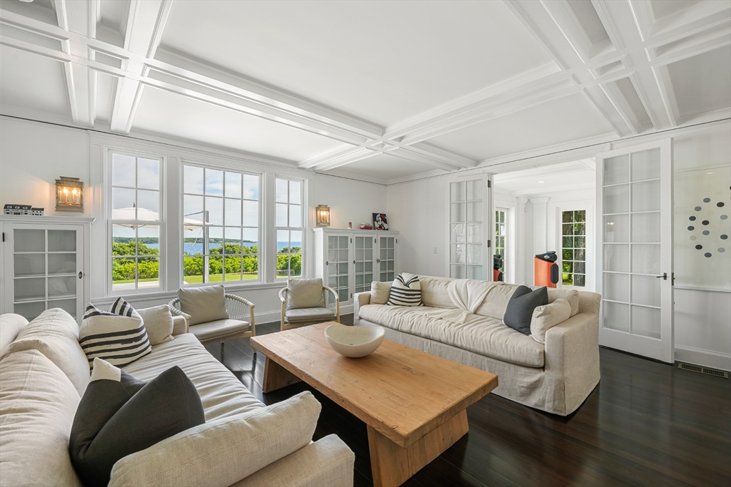 169 S Road Bourne, MA 02559 - Photo 13 of 42 a living room with furniture and a large window