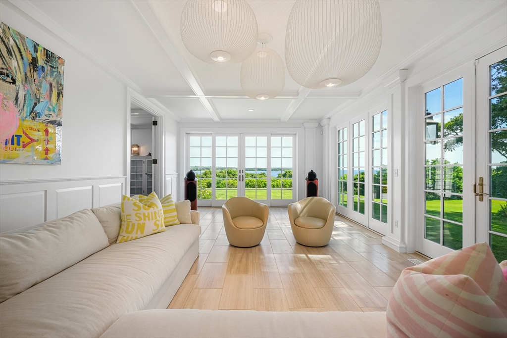 169 S Road Bourne, MA 02559 - Photo 14 of 42 a living room with furniture and a large window with outer view