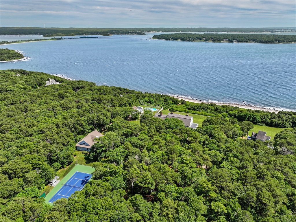 169 S Road Bourne, MA 02559 - Photo 2 of 42 a view of a yard with a lake