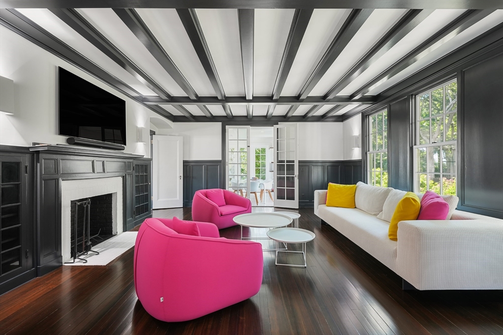 169 S Road Bourne, MA 02559 - Photo 21 of 42 a living room with furniture fireplace and flat screen tv