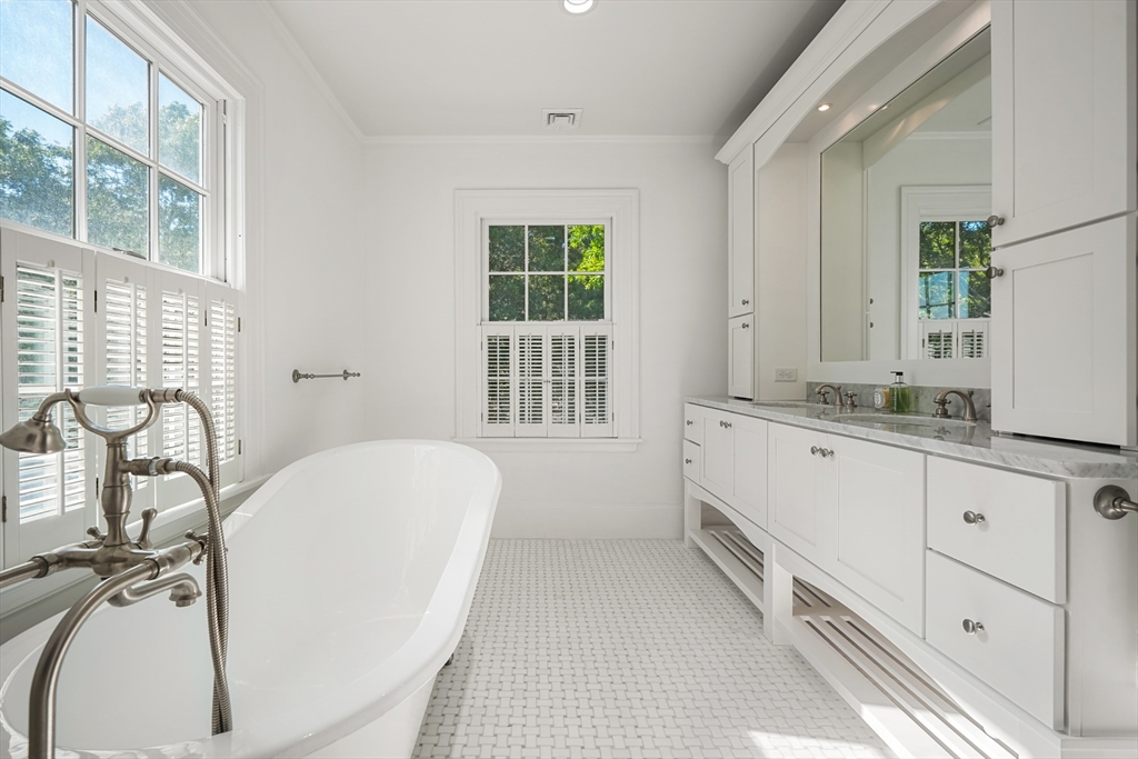 169 S Road Bourne, MA 02559 - Photo 24 of 42 a bathroom with a granite countertop sink and a bathtub