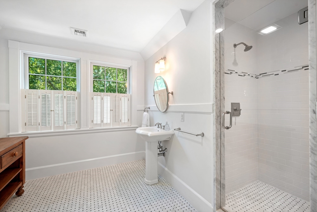169 S Road Bourne, MA 02559 - Photo 26 of 42 a bathroom with a sink a toilet and shower