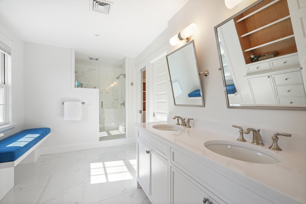 169 S Road Bourne, MA 02559 - Photo 28 of 42 a bathroom with a sink a toilet and mirror