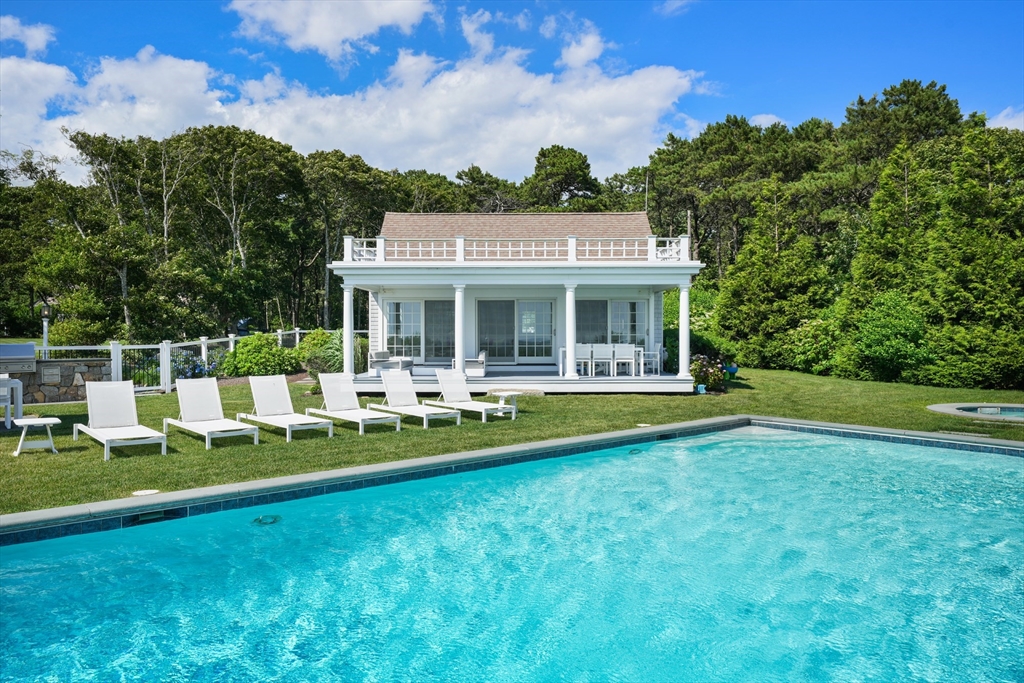 169 S Road Bourne, MA 02559 - Photo 30 of 42 a view of house with a yard table and chairs