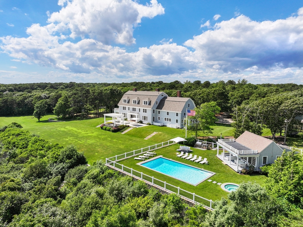 169 S Road Bourne, MA 02559 - Photo 3 of 42 a view of a table and chairs in the garden