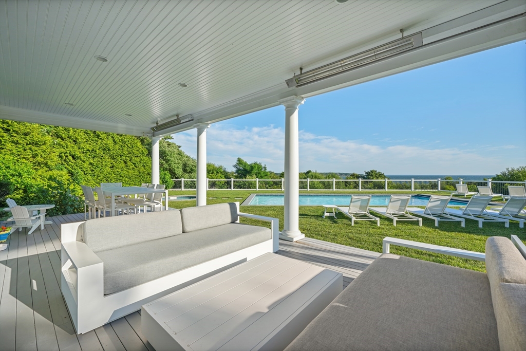 169 S Road Bourne, MA 02559 - Photo 31 of 42 a view of swimming pool with couch and chairs