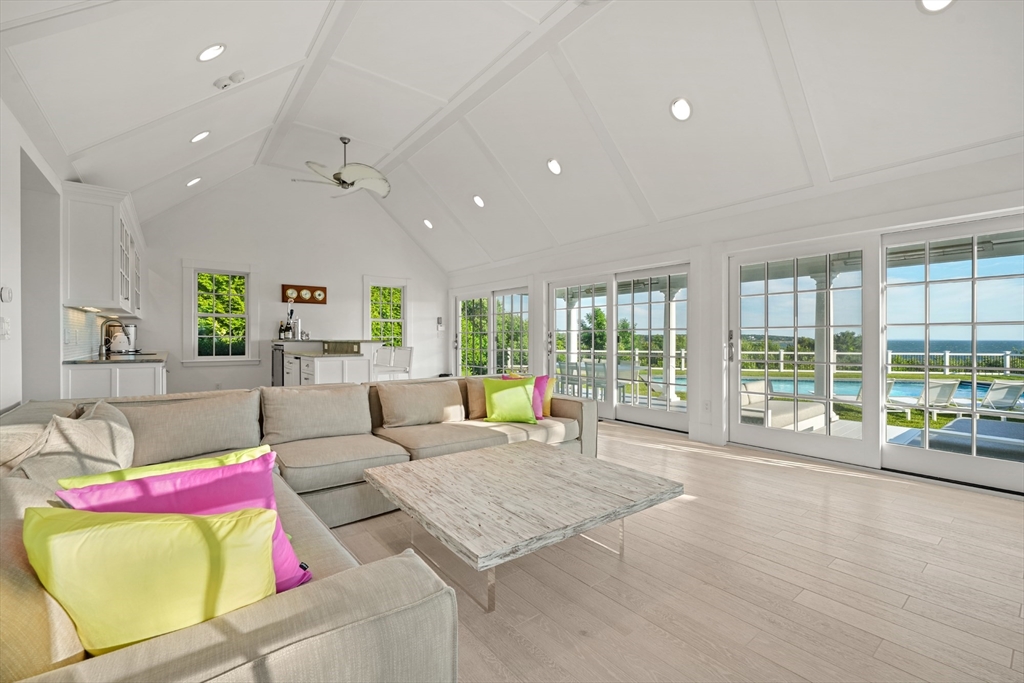 169 S Road Bourne, MA 02559 - Photo 32 of 42 a living room with furniture and a large window