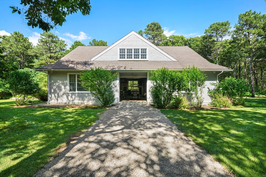 169 S Road Bourne, MA 02559 - Photo 39 of 42 a front view of a house with a garden