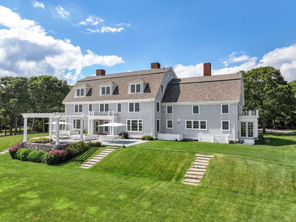 169 S Road Bourne, MA 02559 - Photo 4 of 42 a view of a house with a backyard