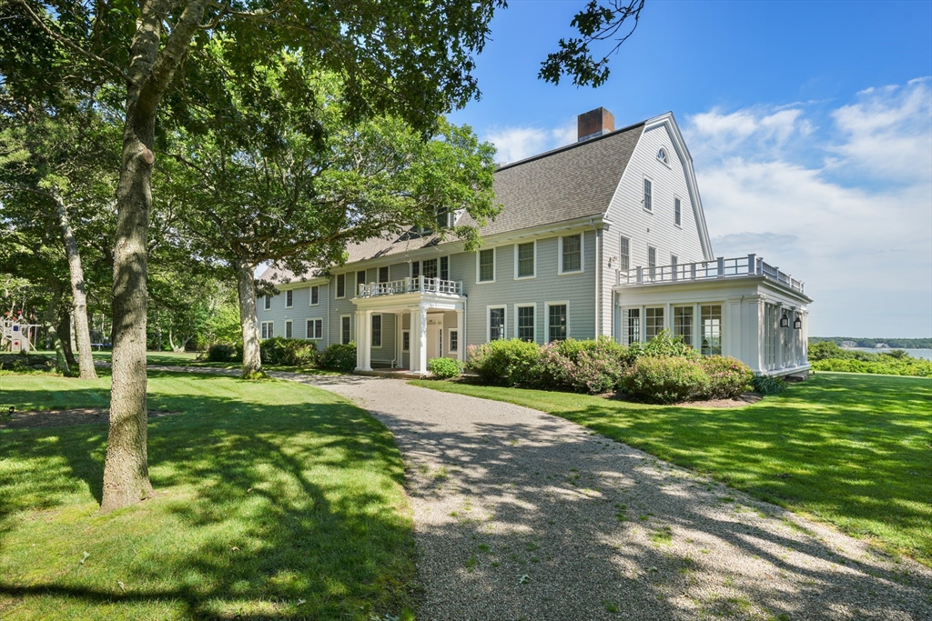 169 S Road Bourne, MA 02559 - Photo 10 of 42 a front view of a house with a yard