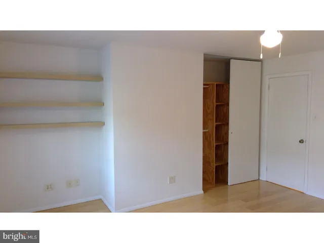 a open space with a cabinet and mirror