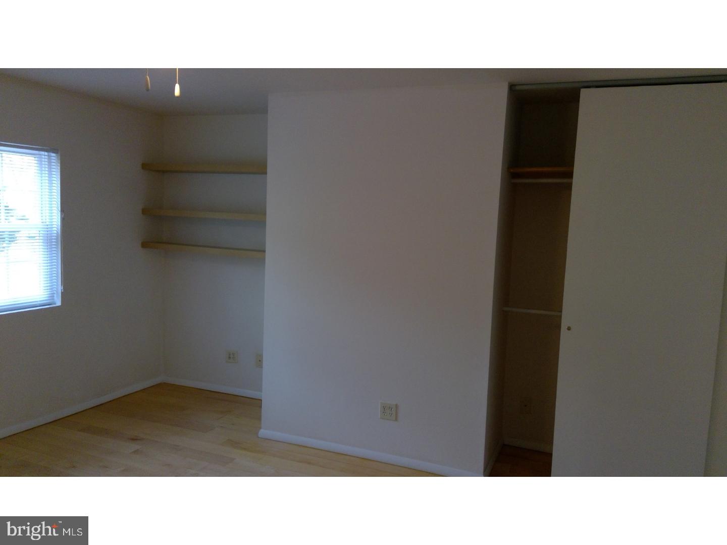 379 Old Forge Crossing Devon, PA 19333 - Photo 12 of 15 a open space with a cabinet and mirror