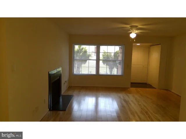 a open hall with a floor to ceiling window