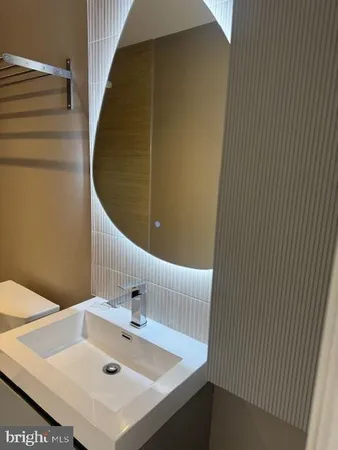a bathroom with a sink and vanity