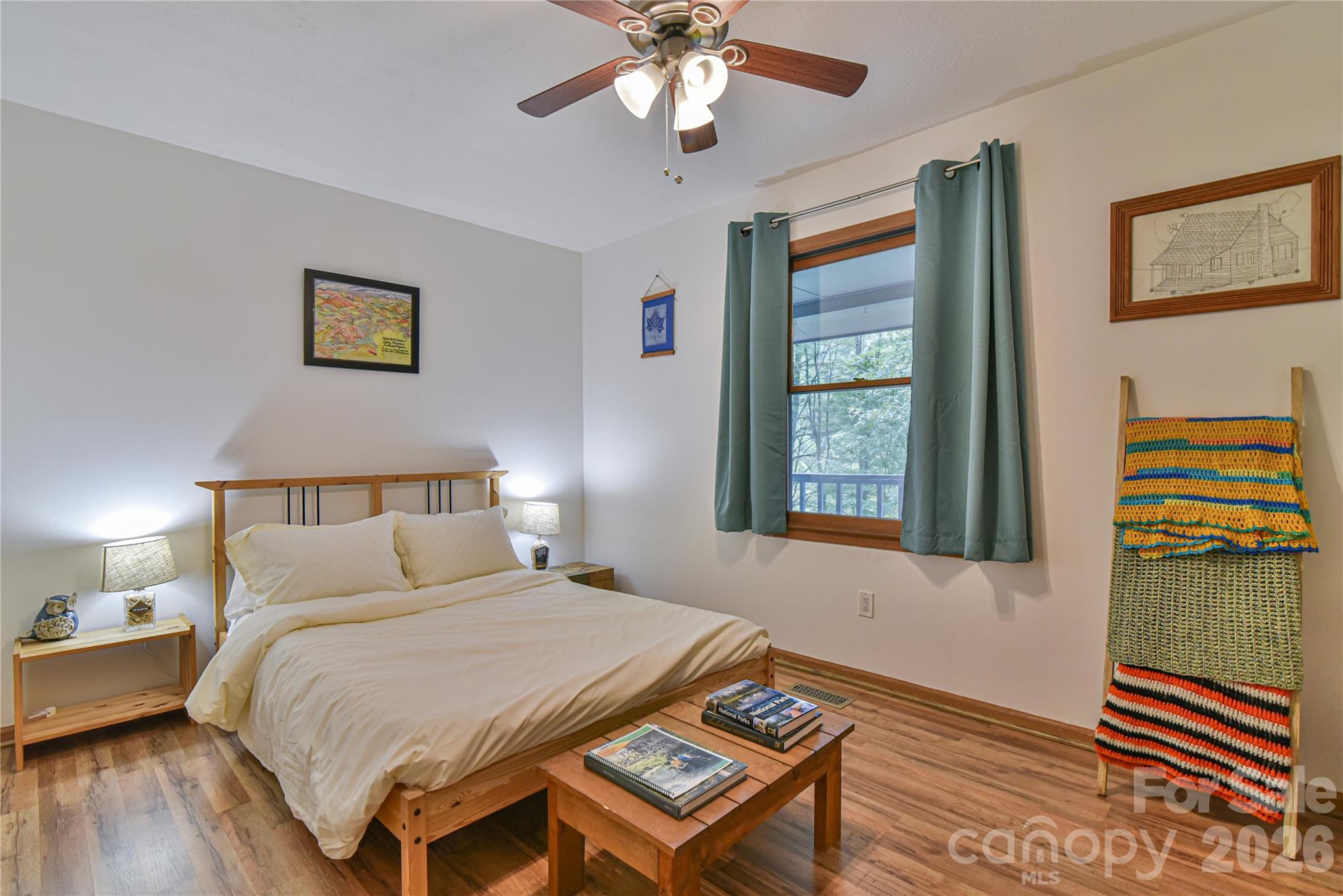 10 Gentry Branch Road Weaverville, NC 28787 - Photo 13 of 33 a bedroom with a bed and a chandelier