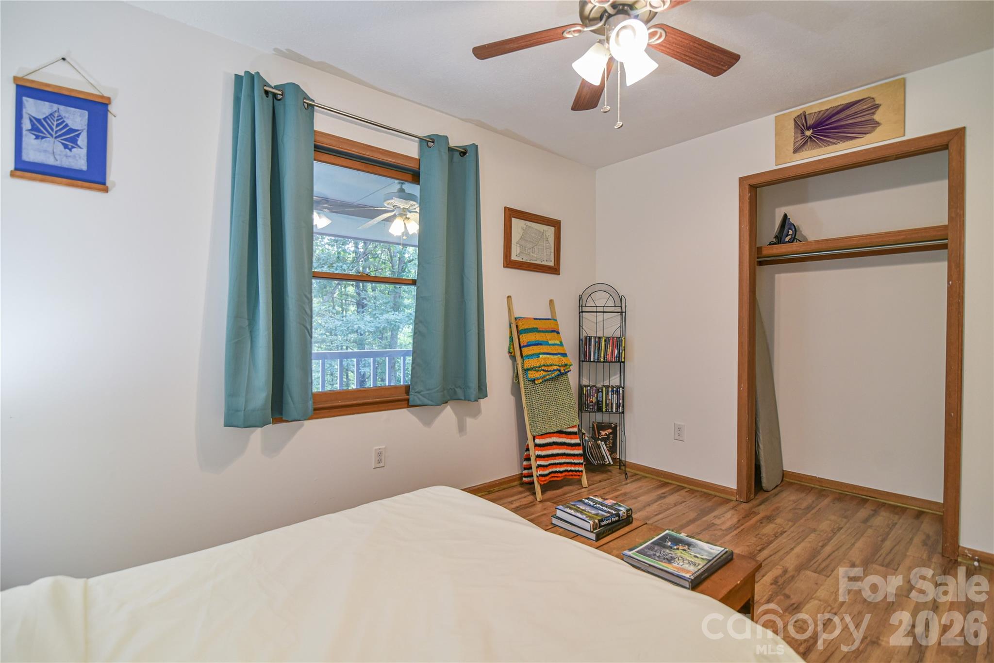 10 Gentry Branch Road Weaverville, NC 28787 - Photo 14 of 33 a bedroom with a bed and a chandelier