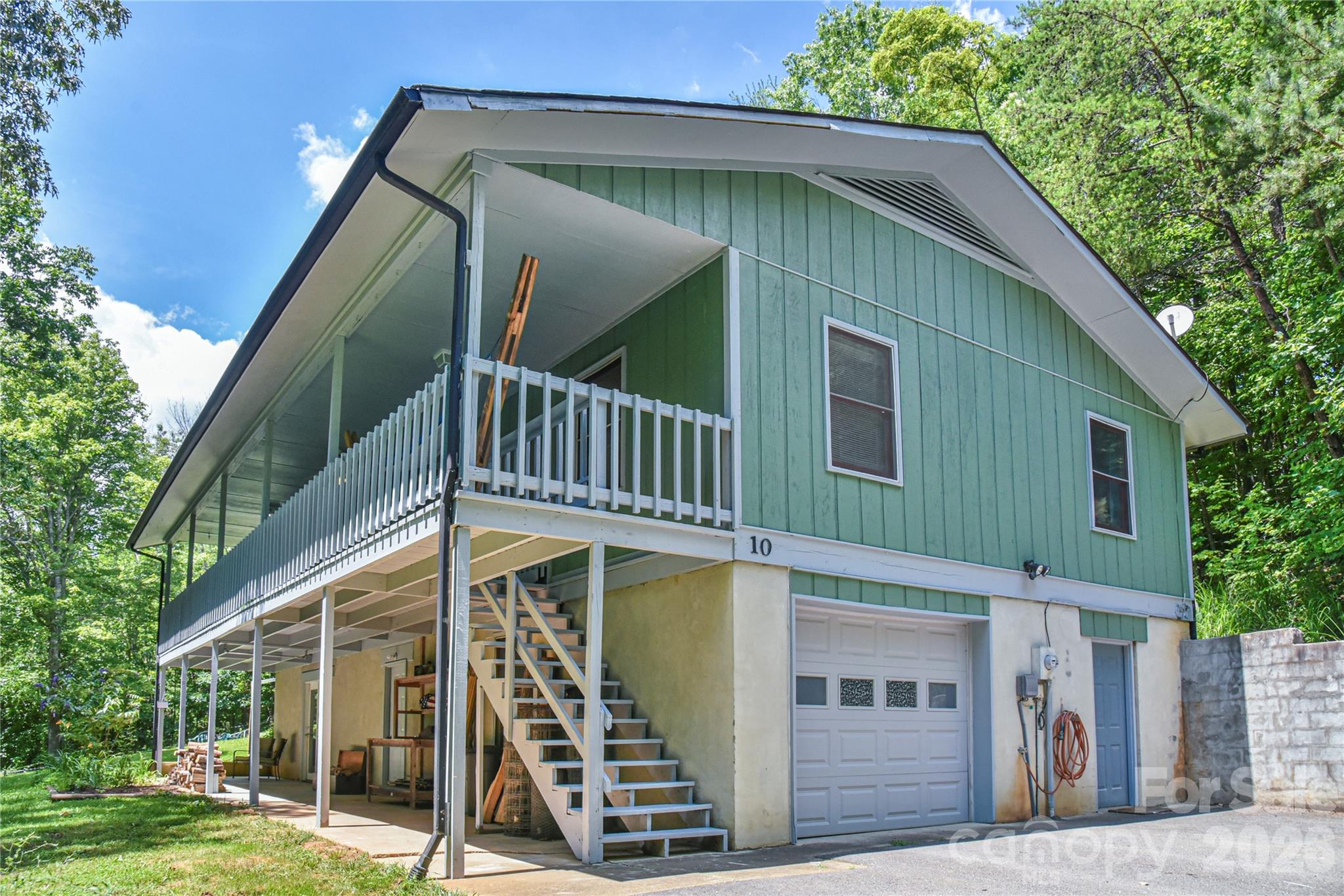 10 Gentry Branch Road Weaverville, NC 28787 - Photo 2 of 33 a front view of a house with garden