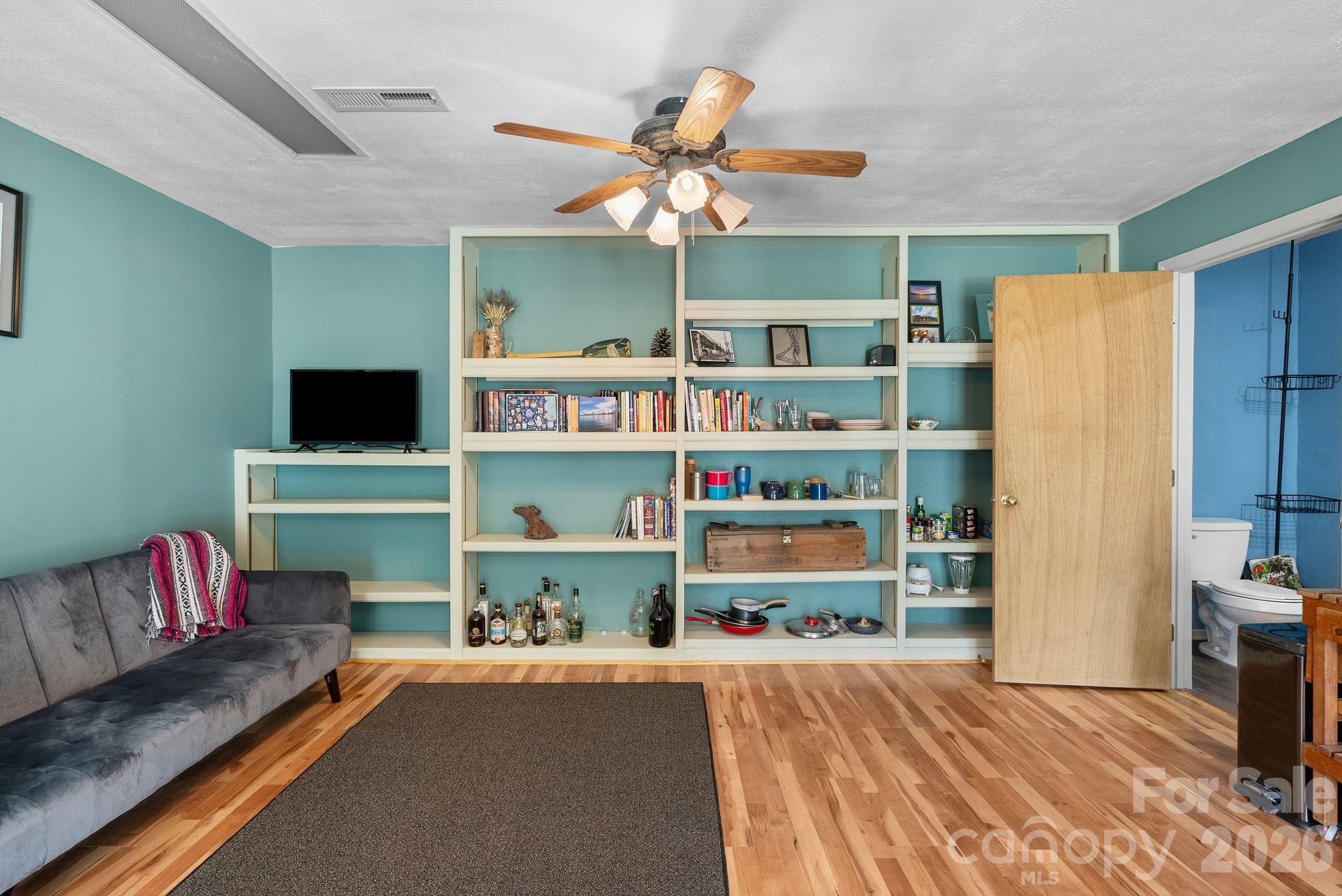 10 Gentry Branch Road Weaverville, NC 28787 - Photo 23 of 33 a living room with furniture and a flat screen tv