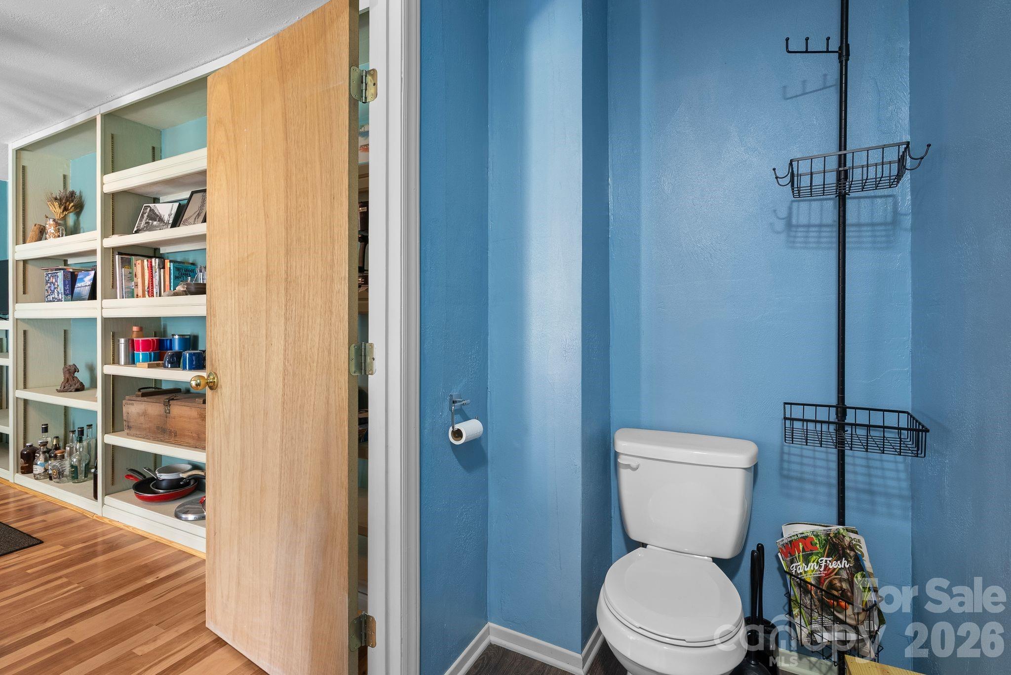 10 Gentry Branch Road Weaverville, NC 28787 - Photo 25 of 33 a white toilet sitting next to a bathroom sink
