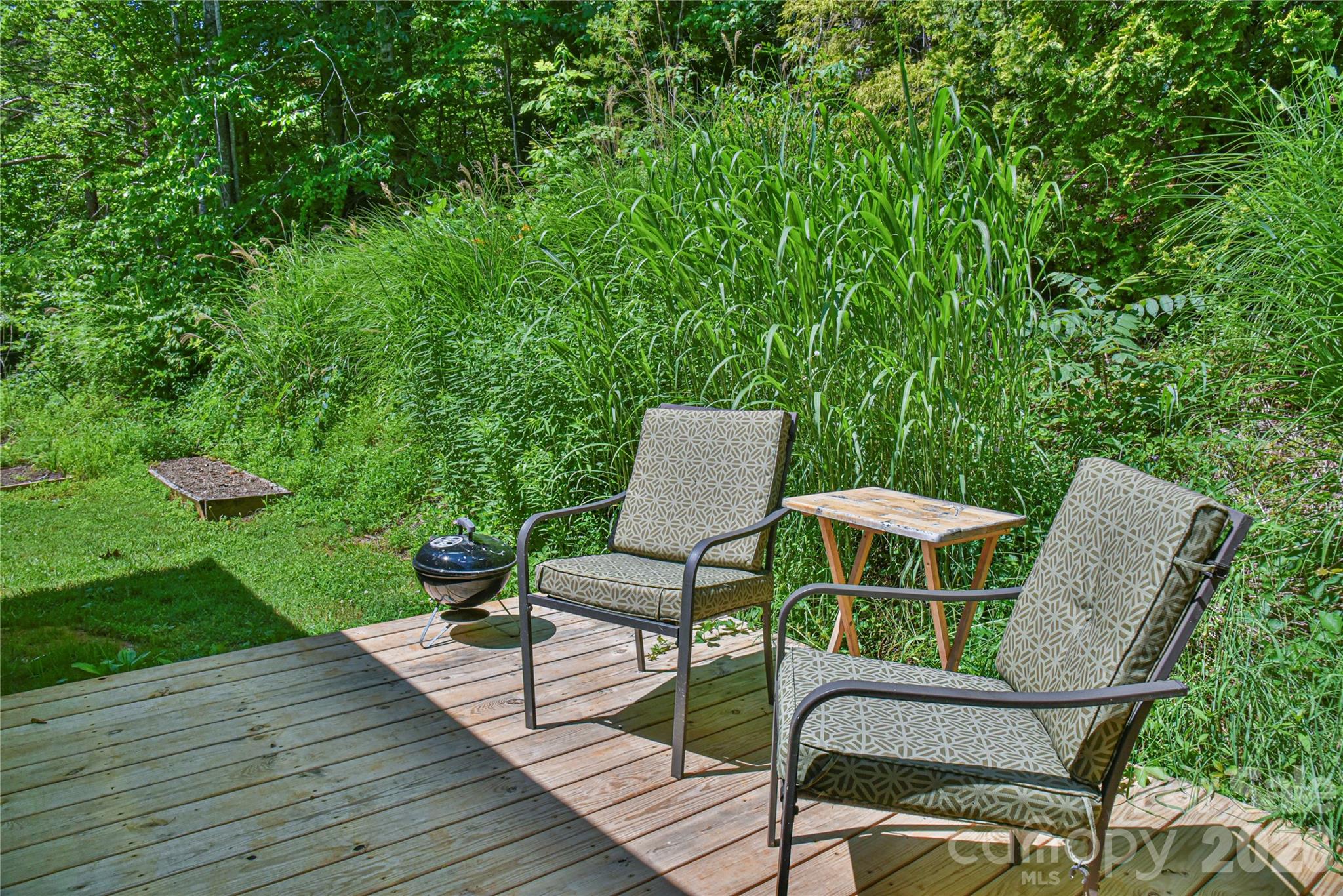 10 Gentry Branch Road Weaverville, NC 28787 - Photo 27 of 33 a view of a chairs in backyard of the house