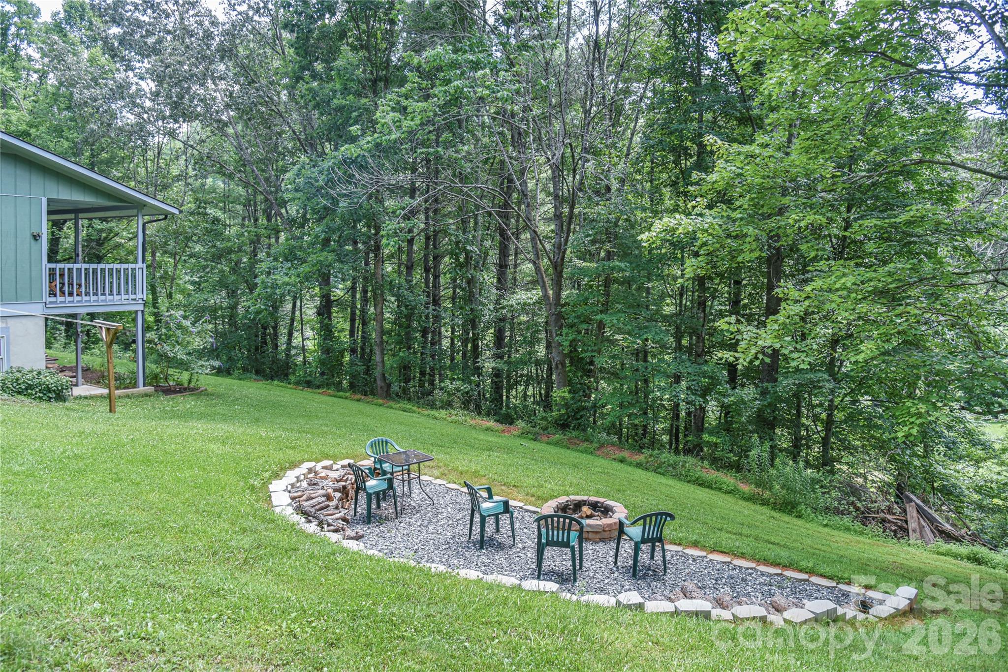 10 Gentry Branch Road Weaverville, NC 28787 - Photo 29 of 33 a view of a table and chairs in the garden