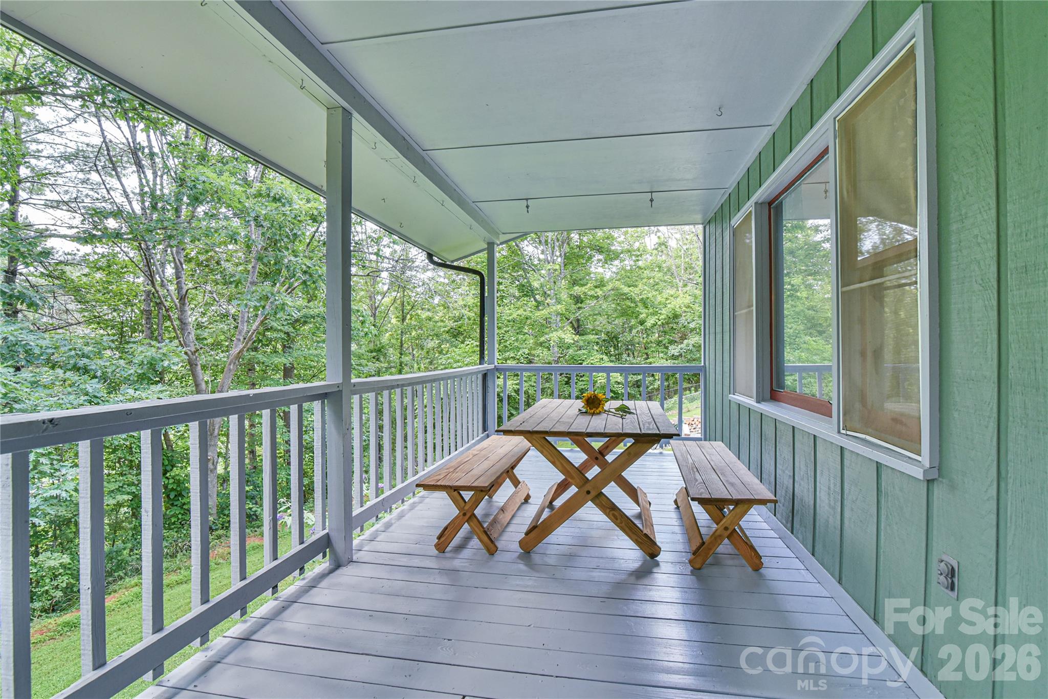 10 Gentry Branch Road Weaverville, NC 28787 - Photo 3 of 33 a view of a two chairs with wooden floor and roof