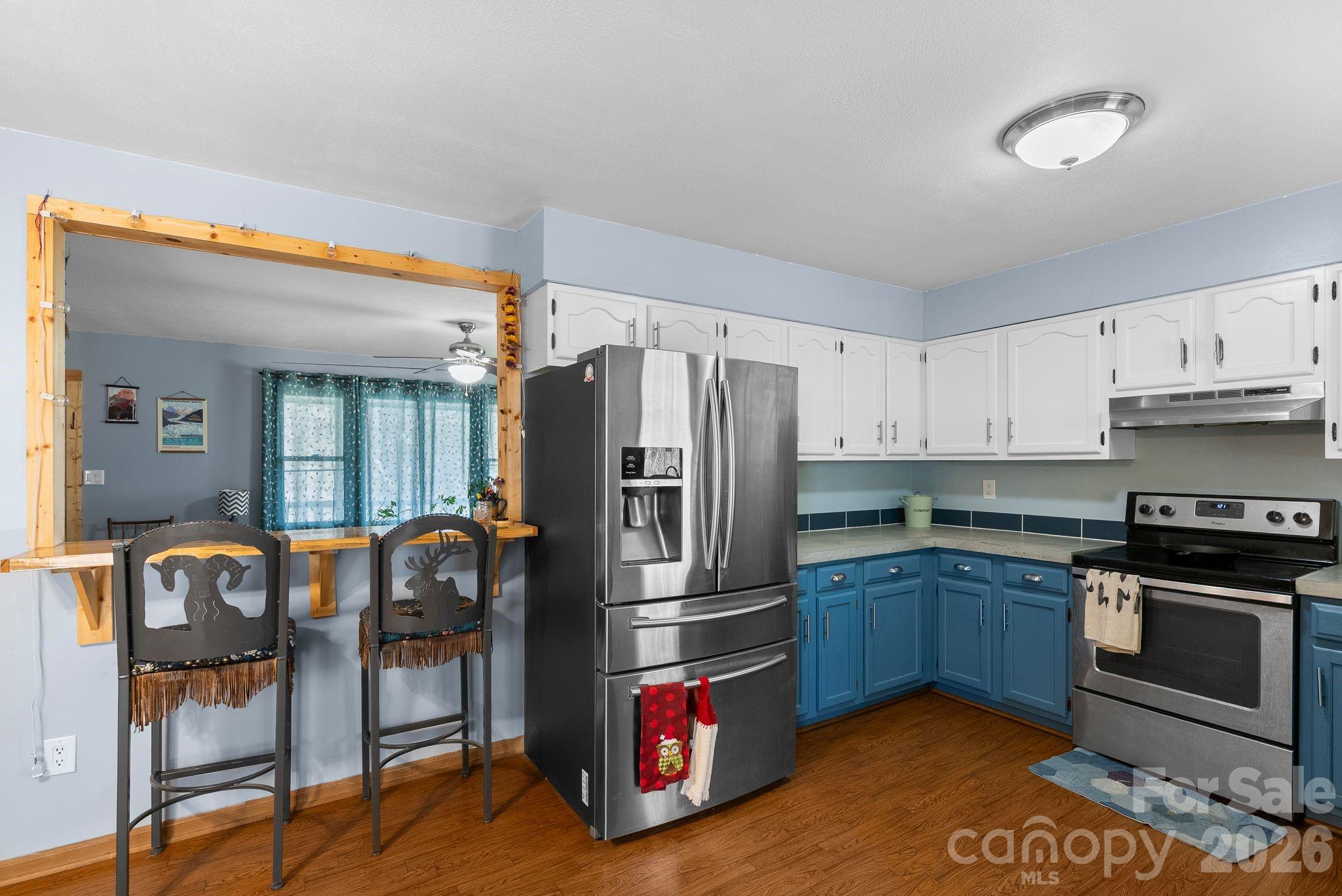 10 Gentry Branch Road Weaverville, NC 28787 - Photo 6 of 33 a kitchen with stainless steel appliances granite countertop a refrigerator and stove