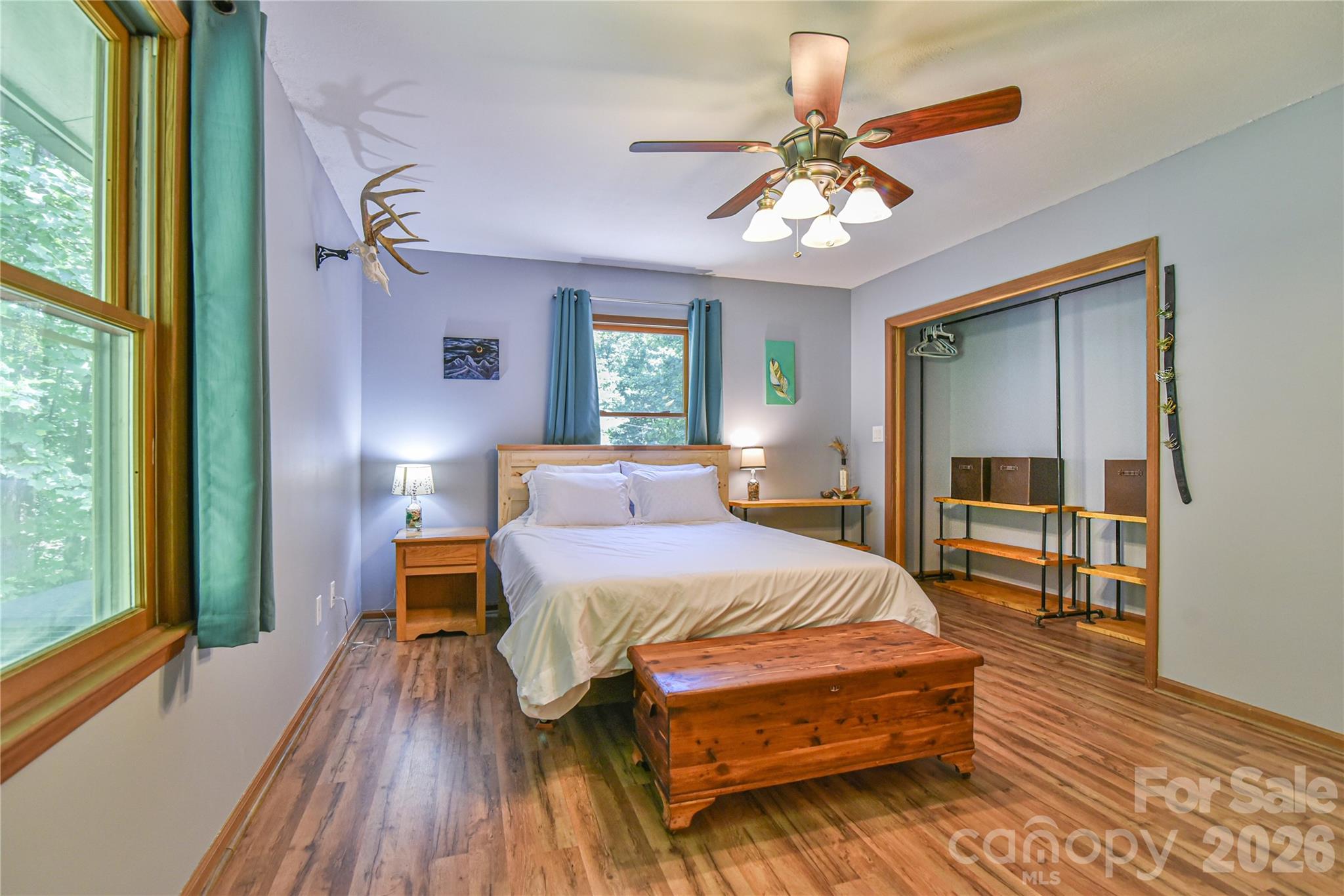 10 Gentry Branch Road Weaverville, NC 28787 - Photo 10 of 33 a bedroom with a bed and a chandelier