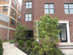 30 Elm Place, Unit 4B Rye, NY 10580 - Photo 1 of 1 a view of a building next to a yard