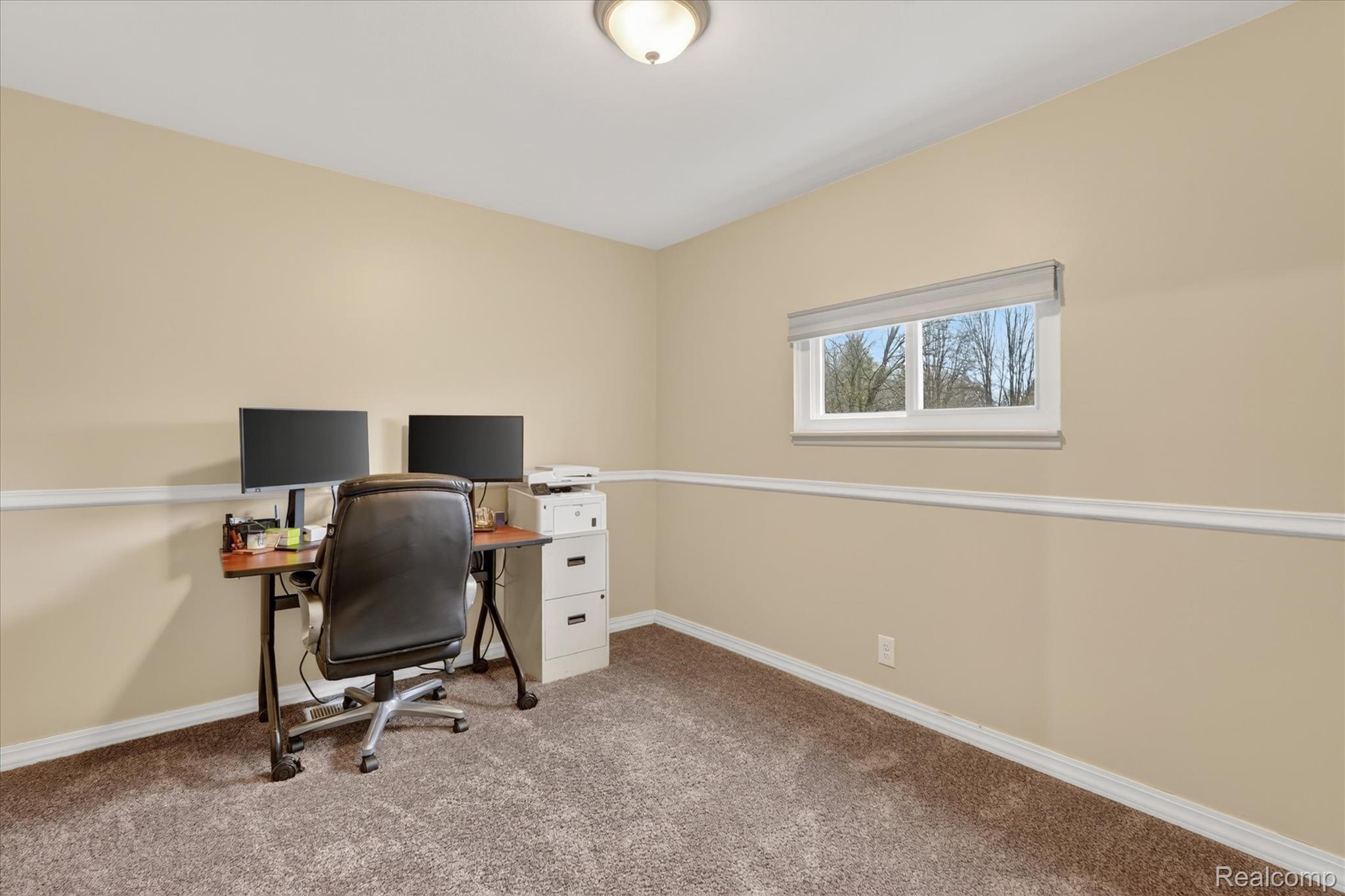 13508 North Center Road Clio, MI 48420 - Photo 28 of 38 Home office with light carpet and baseboards