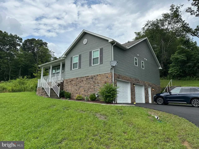 a house view with a garden space