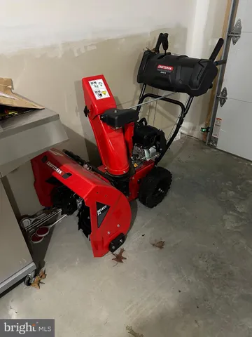 a view of backyard of house with green space